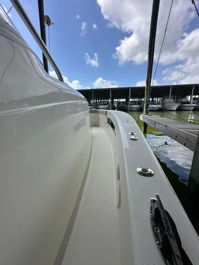 Wooocrew Yacht Photos Pics 2015 SeaVee 43 Fish-Around boat docked under a blue sky.