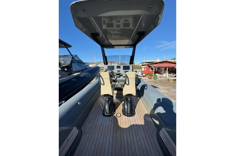  Yacht Photos Pics 2023 Rock Marine ROCK 30 boat interior with dual seats and steering console.