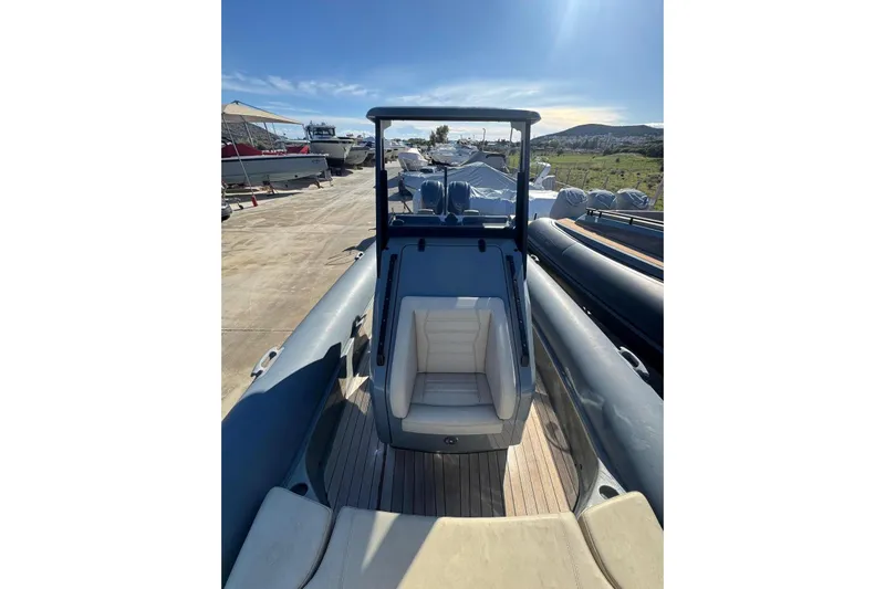 Yacht Photos Pics 2023 Rock Marine ROCK 30 boat with sleek design, docked under clear blue sky.
