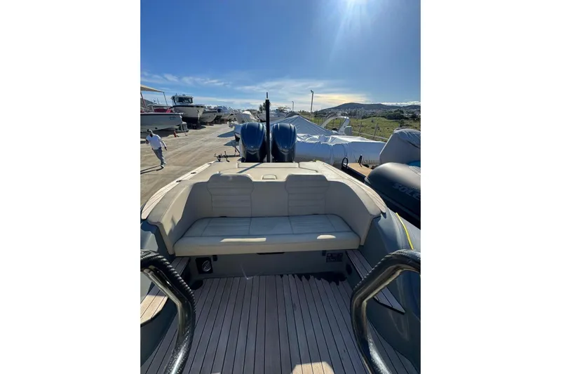  Yacht Photos Pics 2023 Rock Marine ROCK 30 boat with spacious seating and dual engines, docked under sunny skies.