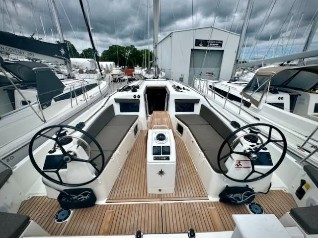 410 #345 In Stock Yacht Photos Pics 2024 Jeanneau Sun Odyssey 410 sailboat cockpit with dual steering wheels and teak decking.