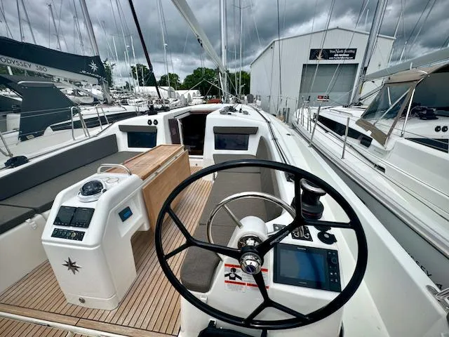 410 #345 In Stock Yacht Photos Pics 2024 Jeanneau Sun Odyssey 410 sailboat cockpit with modern steering and navigation systems.