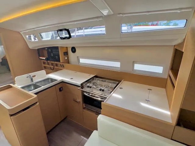 410 #345 In Stock Yacht Photos Pics Modern kitchen interior of 2024 Jeanneau Sun Odyssey 410 yacht.