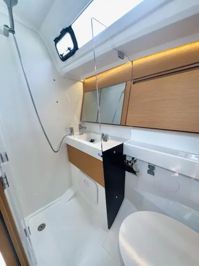 410 #345 In Stock Yacht Photos Pics 2024 Jeanneau Sun Odyssey 410 bathroom with modern fixtures and sleek design.