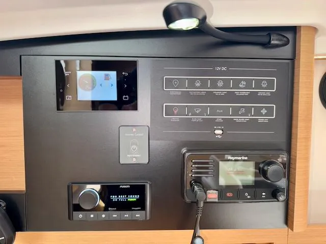 410 #345 In Stock Yacht Photos Pics Control panel of 2024 Jeanneau Sun Odyssey 410 yacht with navigation and audio systems.