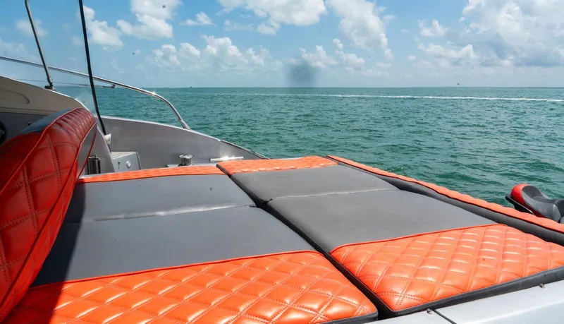 D Padron Yacht Photos Pics Azimut Atlantis 58 yacht, 2013 model, with orange seating, cruising on open water.