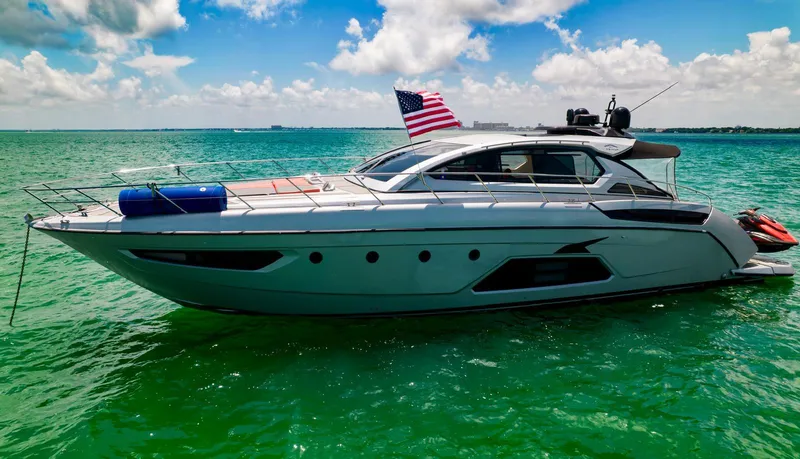 D Padron Yacht Photos Pics Azimut Atlantis 58 yacht from 2013 on turquoise water, American flag waving.