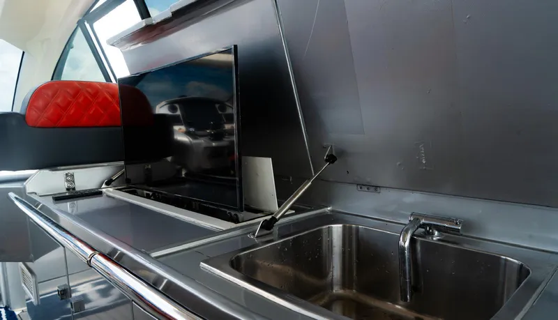 D Padron Yacht Photos Pics Modern kitchen area on a 2013 Azimut Atlantis 58 yacht with stainless steel sink.