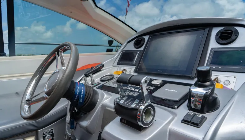 D Padron Yacht Photos Pics Cockpit of 2013 Azimut Atlantis 58 yacht with modern navigation controls and steering wheel.