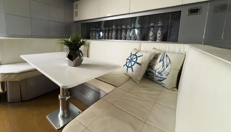 D Padron Yacht Photos Pics Luxurious interior of 2013 Azimut Atlantis 58 yacht with elegant seating and nautical decor.