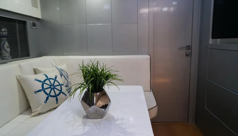 D Padron Yacht Photos Pics Interior of 2013 Azimut Atlantis 58 yacht with modern decor and nautical-themed cushions.