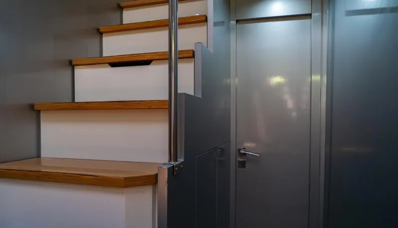 D Padron Yacht Photos Pics Staircase and door inside 2013 Azimut Atlantis 58 yacht, featuring modern design elements.