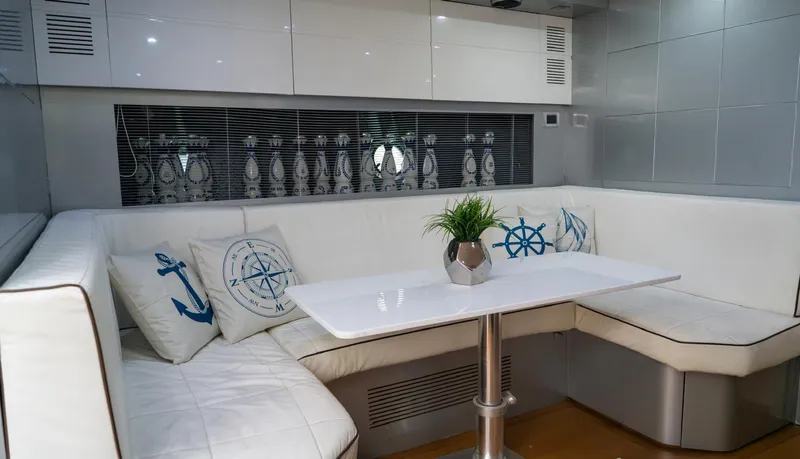 D Padron Yacht Photos Pics Luxurious interior of 2013 Azimut Atlantis 58 yacht with white seating and nautical decor.