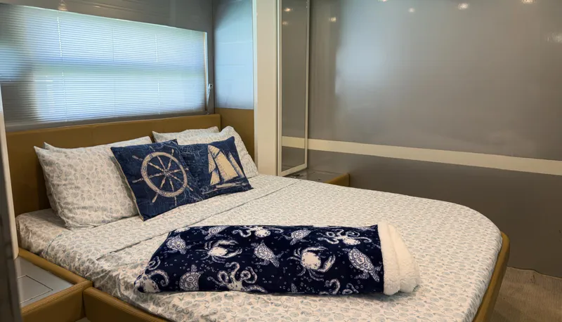 D Padron Yacht Photos Pics Luxurious bedroom interior of 2013 Azimut Atlantis 58 yacht with nautical-themed decor.