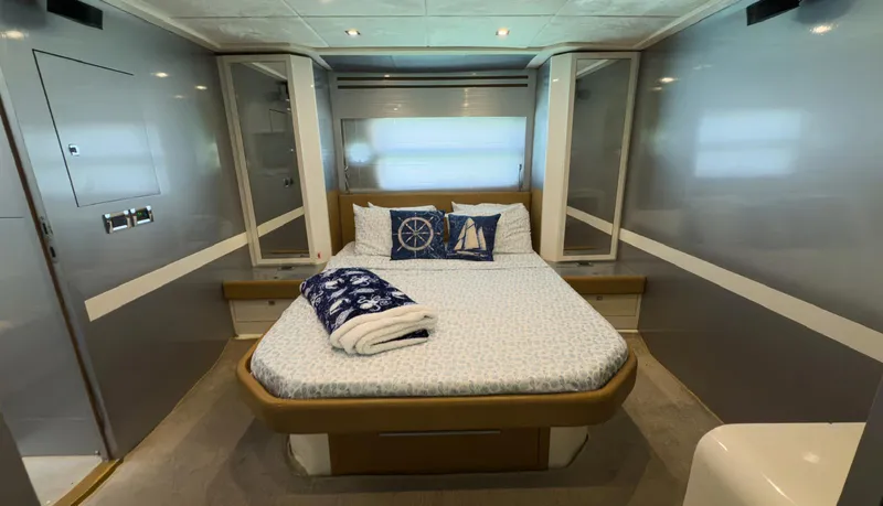 D Padron Yacht Photos Pics Luxurious bedroom interior of 2013 Azimut Atlantis 58 yacht with nautical-themed decor.