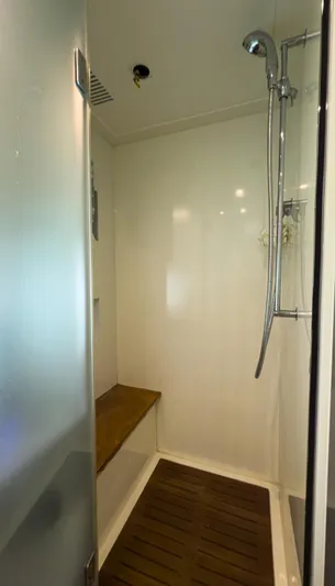 D Padron Yacht Photos Pics Shower area in 2013 Azimut Atlantis 58 yacht with wooden bench and modern fixtures.