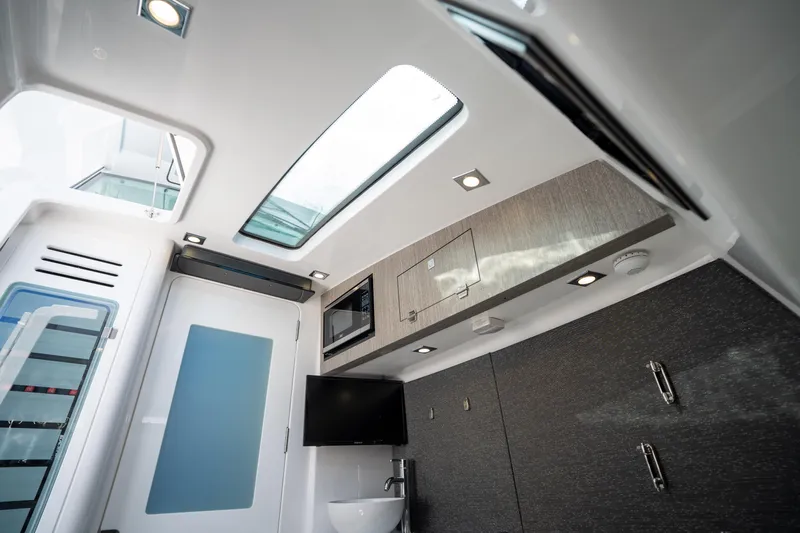  Yacht Photos Pics 2024 Blackfin 400 CC cabin interior with modern amenities and sleek design.