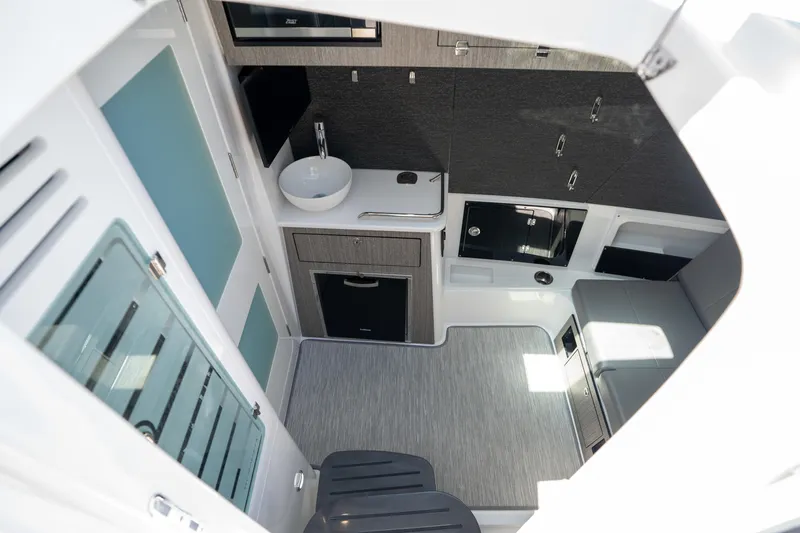  Yacht Photos Pics 2024 Blackfin 400 CC cabin interior with modern amenities and sleek design.