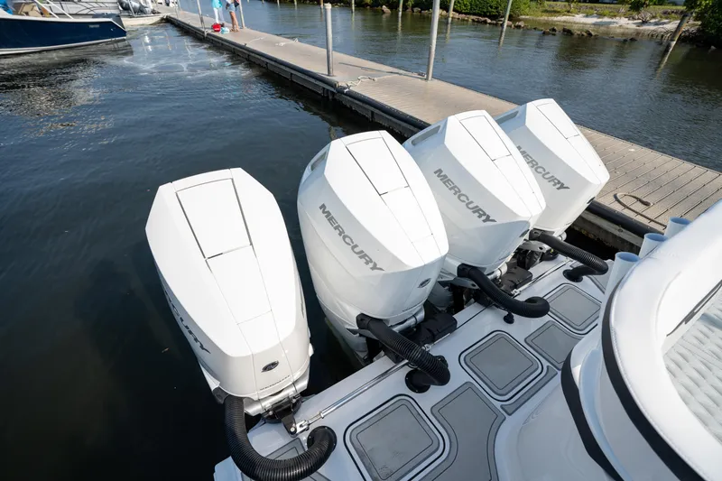  Yacht Photos Pics 2024 Blackfin 400 CC with four Mercury outboard engines docked at marina.