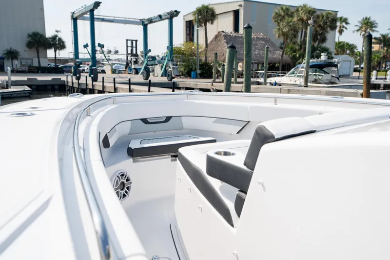  Yacht Photos Pics 2024 Blackfin 400 CC boat interior at marina, showcasing seating and sleek design.
