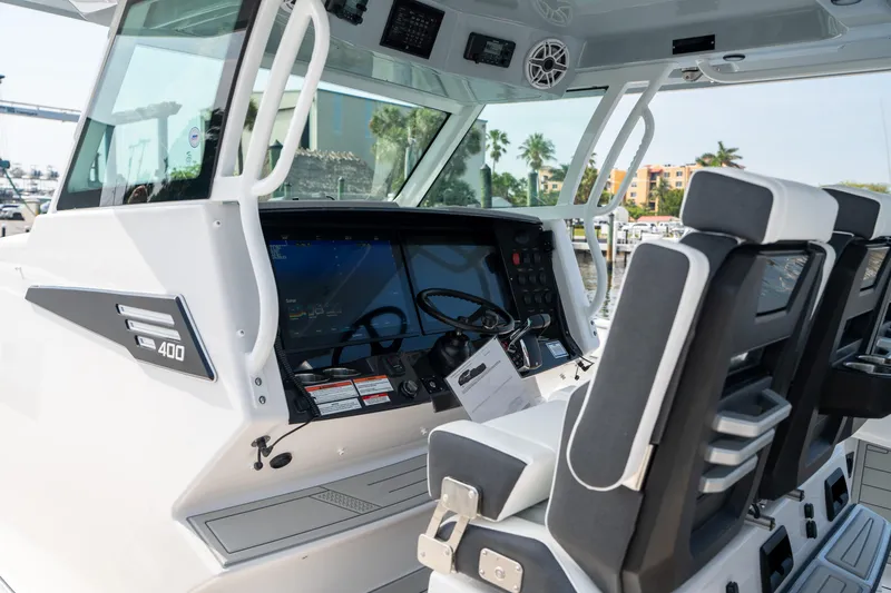  Yacht Photos Pics 2024 Blackfin 400 CC boat cockpit with modern controls and seating.