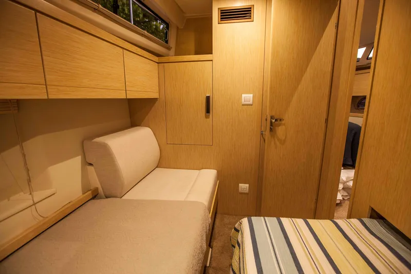 Soteria Yacht Photos Pics 2017 Greenline 40 Hybrid Yacht interior with cozy seating and wooden cabinetry.