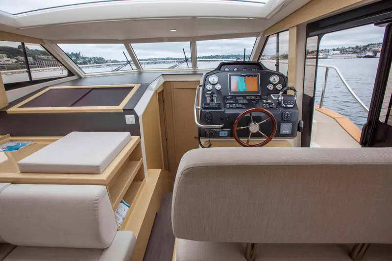 Soteria Yacht Photos Pics 2017 Greenline 40 Hybrid Yacht interior with modern helm and panoramic windows.