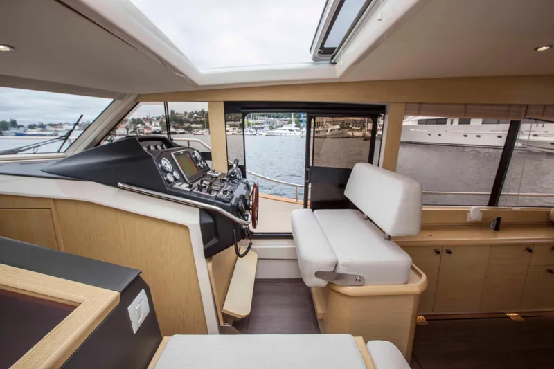 Soteria Yacht Photos Pics Interior of 2017 Greenline 40 Hybrid Yacht, featuring helm and seating area.
