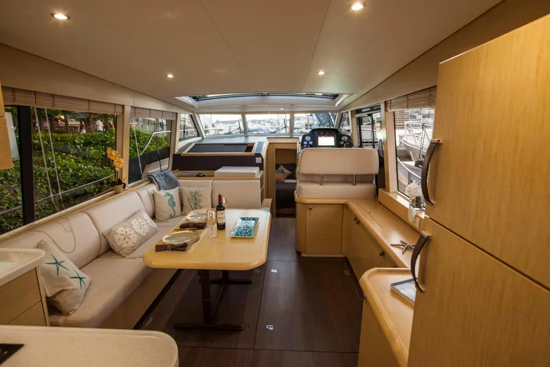 Soteria Yacht Photos Pics Interior of 2017 Greenline 40 Hybrid Yacht, featuring modern seating and dining area.
