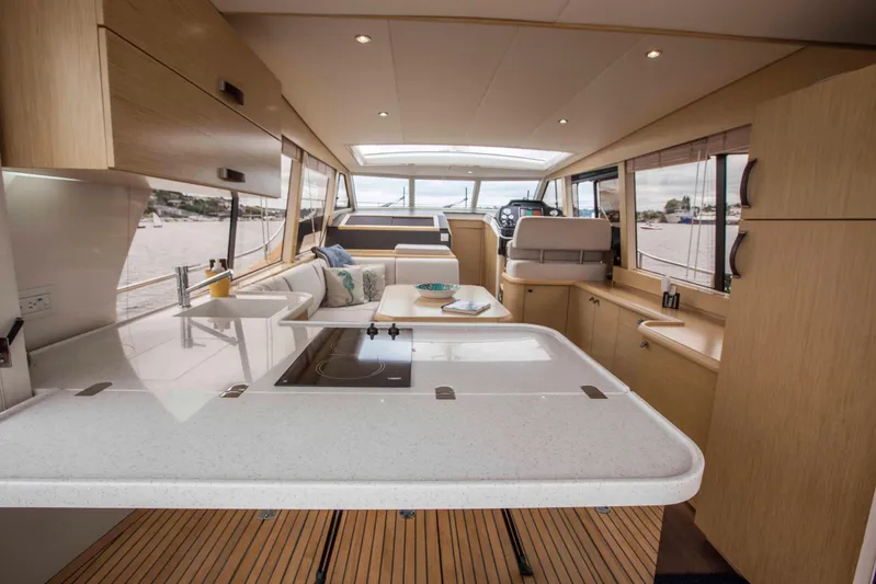 Soteria Yacht Photos Pics Interior of 2017 Greenline 40 Hybrid Yacht with modern kitchen and seating area.