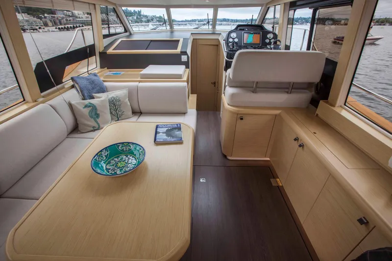 Soteria Yacht Photos Pics Interior of 2017 Greenline 40 Hybrid Yacht with modern seating and helm.