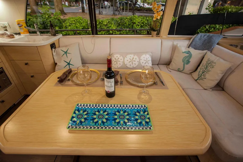 Soteria Yacht Photos Pics Luxurious dining area on 2017 Greenline 40 Hybrid Yacht with elegant table setting.