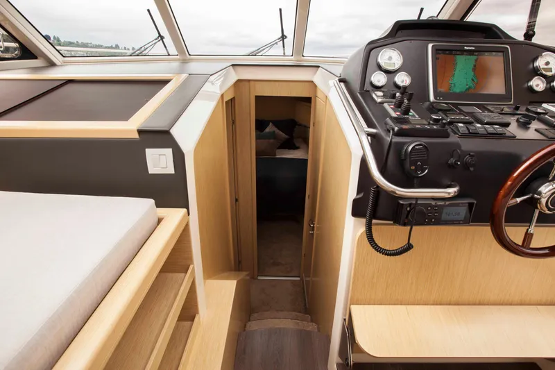 Soteria Yacht Photos Pics 2017 Greenline 40 Hybrid yacht interior with navigation controls and cabin entrance.