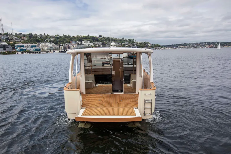 Soteria Yacht Photos Pics 2017 Greenline 40 Hybrid Diesel/Electric Yacht on calm water, rear view.