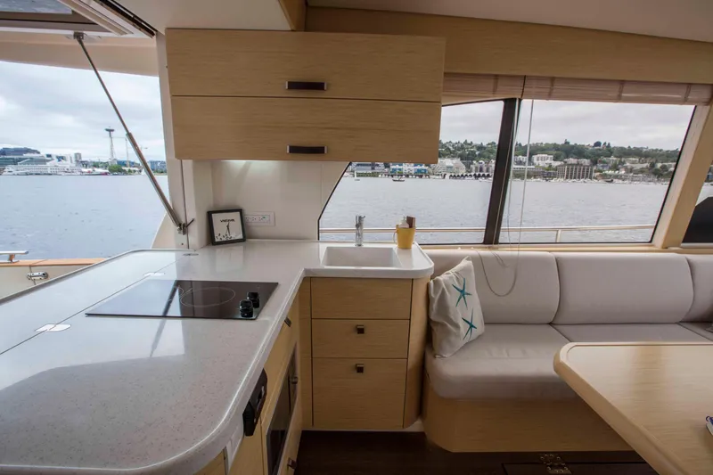 Soteria Yacht Photos Pics Interior of 2017 Greenline 40 Hybrid Yacht with modern kitchen and waterfront view.