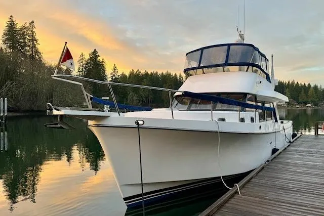 Kokomo Yacht Photos Pics 1997 Ocean Alexander 426 Classico yacht docked at serene lake during sunset.