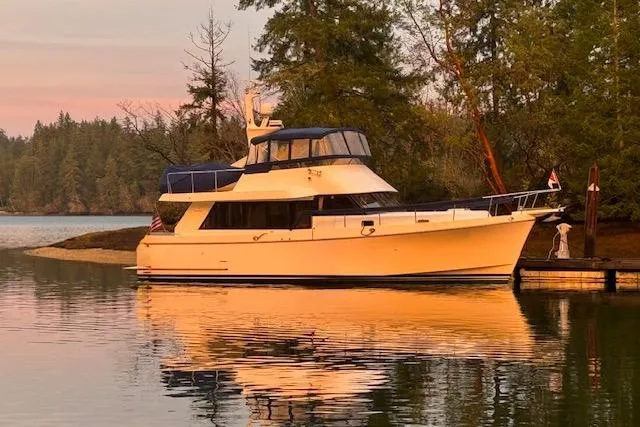 Kokomo Yacht Photos Pics Ocean Alexander 426 Classico yacht, 1997 model, docked by serene forested waters.