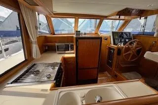 Kokomo Yacht Photos Pics 1997 Ocean Alexander 426 Classico yacht interior with kitchen and helm station.