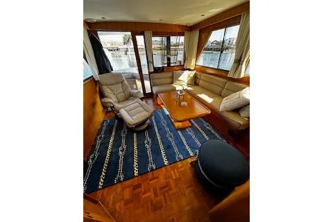 Kokomo Yacht Photos Pics Luxurious interior of 1997 Ocean Alexander 426 Classico yacht with elegant seating and nautical decor.