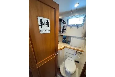 Kokomo Yacht Photos Pics Restroom in 1997 Ocean Alexander 426 Classico yacht, featuring compact design and amenities.