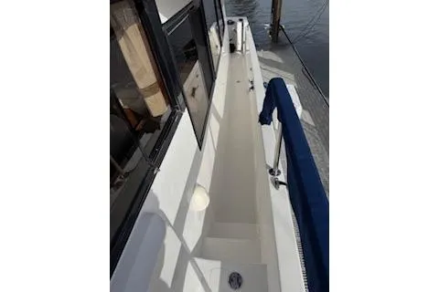 Kokomo Yacht Photos Pics 1997 Ocean Alexander 426 Classico yacht deck with blue railing and window view.