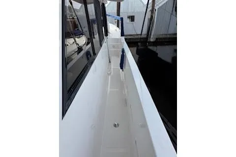 Kokomo Yacht Photos Pics Side deck of 1997 Ocean Alexander 426 Classico yacht, docked at marina.