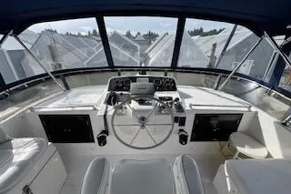 Kokomo Yacht Photos Pics 1997 Ocean Alexander 426 Classico yacht helm with steering wheel and navigation controls.