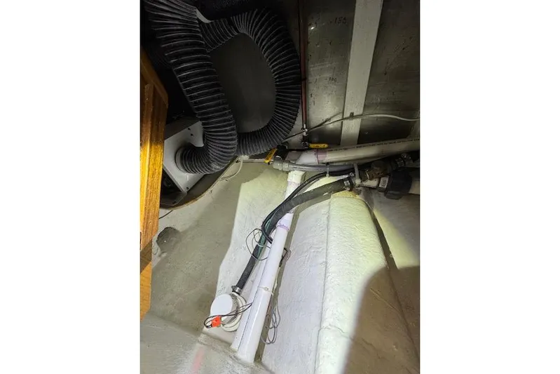 Kokomo Yacht Photos Pics 1997 Ocean Alexander 426 Classico engine room with visible pipes and wiring.