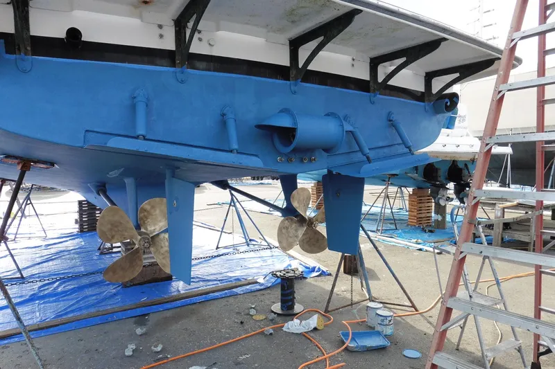 Kokomo Yacht Photos Pics 1997 Ocean Alexander 426 Classico Sedan undergoing maintenance with visible propellers and blue hull.