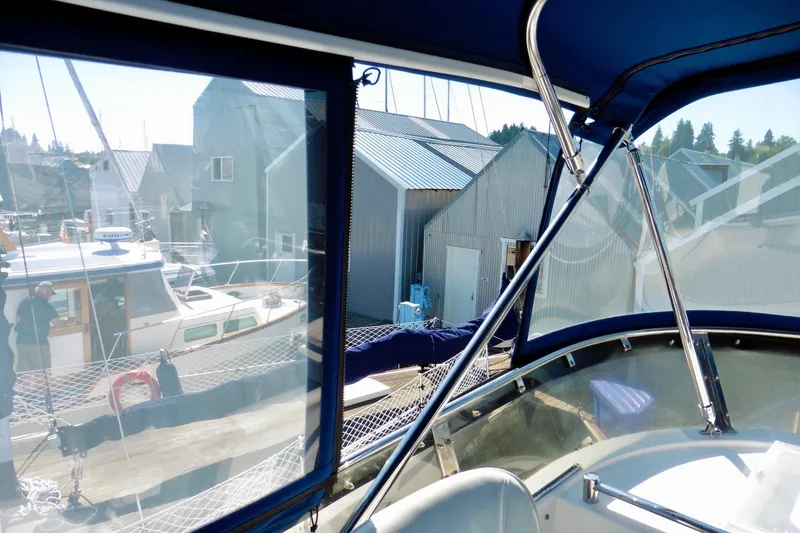 Kokomo Yacht Photos Pics 2000 Ocean Alexander 423 Classico yacht docked near boathouses, view from cockpit.