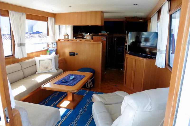 Kokomo Yacht Photos Pics Luxurious interior of 2000 Ocean Alexander 423 Classico yacht with cozy seating and TV.