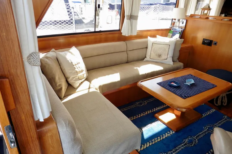 Kokomo Yacht Photos Pics Luxurious interior of 2000 Ocean Alexander 423 Classico yacht with cozy seating and elegant decor.