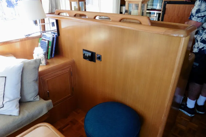 Kokomo Yacht Photos Pics Interior of 2000 Ocean Alexander 423 Classico yacht with wooden cabinetry and seating area.