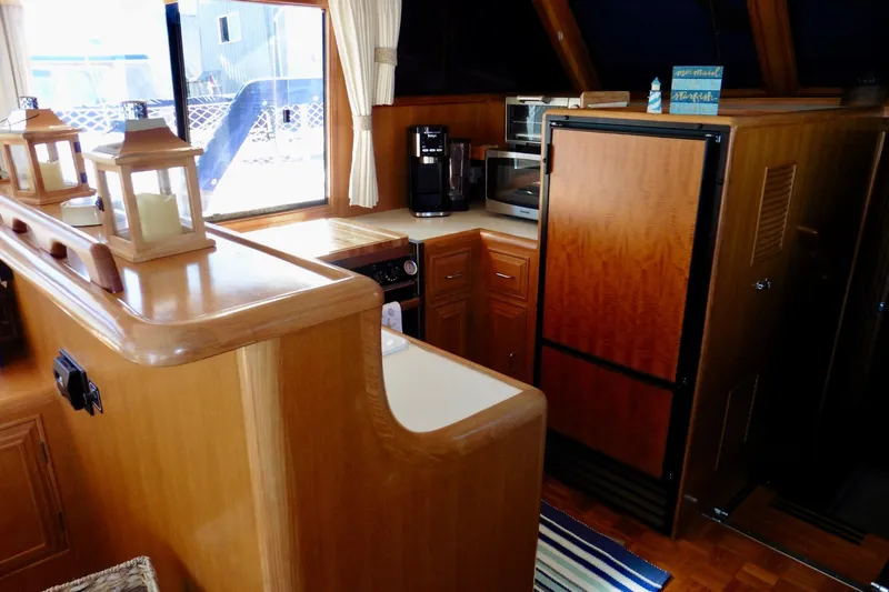 Kokomo Yacht Photos Pics Interior of 2000 Ocean Alexander 423 Classico yacht kitchen with wood cabinetry and appliances.